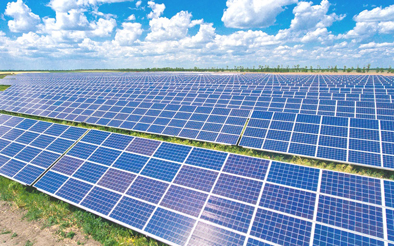 Solar panel installation team working on commercial building